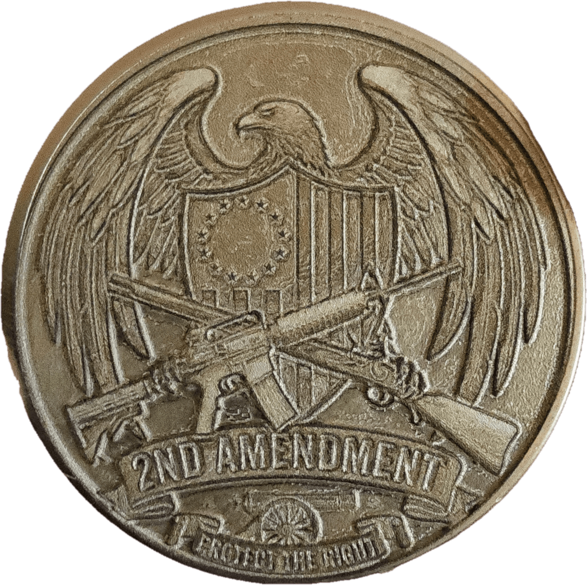 Round engraved collectible featuring an eagle and crossed rifles